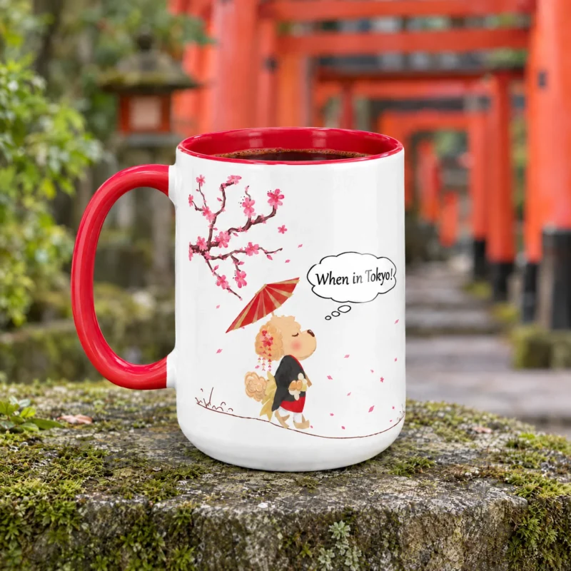 Red-handled 15 oz Tokyo ceramic mug with Ollie the dog, photographed beside a Japanese shrine path with red torii gates.